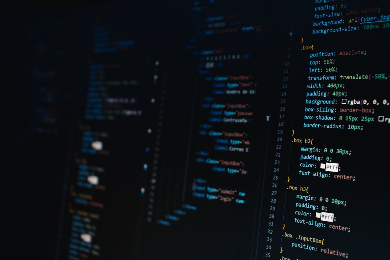 our-story Detailed view of HTML and CSS code on a dark screen, representing modern web development.